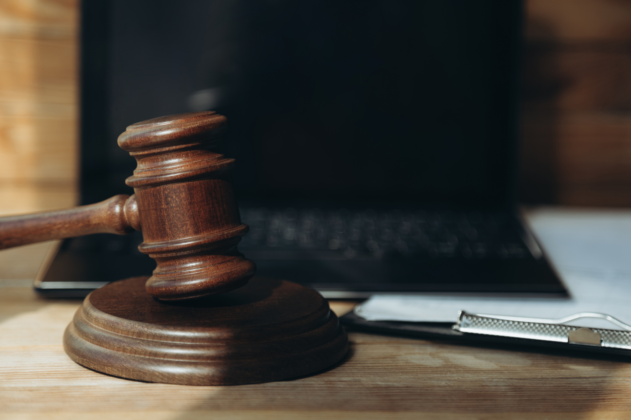 Laptop Gavel Lawyer Gettyimages 2211365487